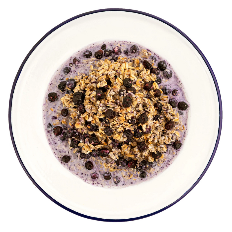 Mountain House granola with milk and blueberries served on white plate