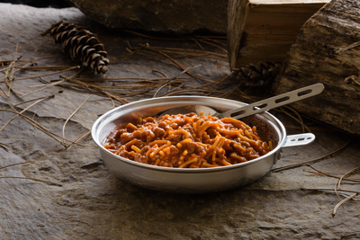 spaghetti with meat sauce served in metal plate